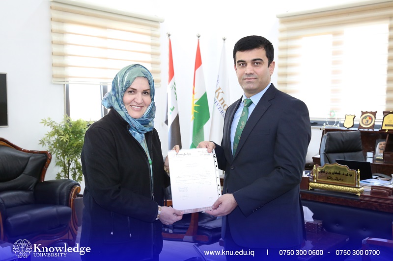 The president of Knowledge University gave an honorary award to Dr. Nohad AlOmari